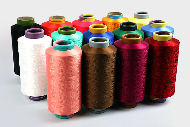 Care sunt avantajele cheie ale utilizării firelor de poliester DTY în aplicații textile și cum contribuie procesul lor de producție la popularitatea și utilizarea pe scară largă în industria textilă?